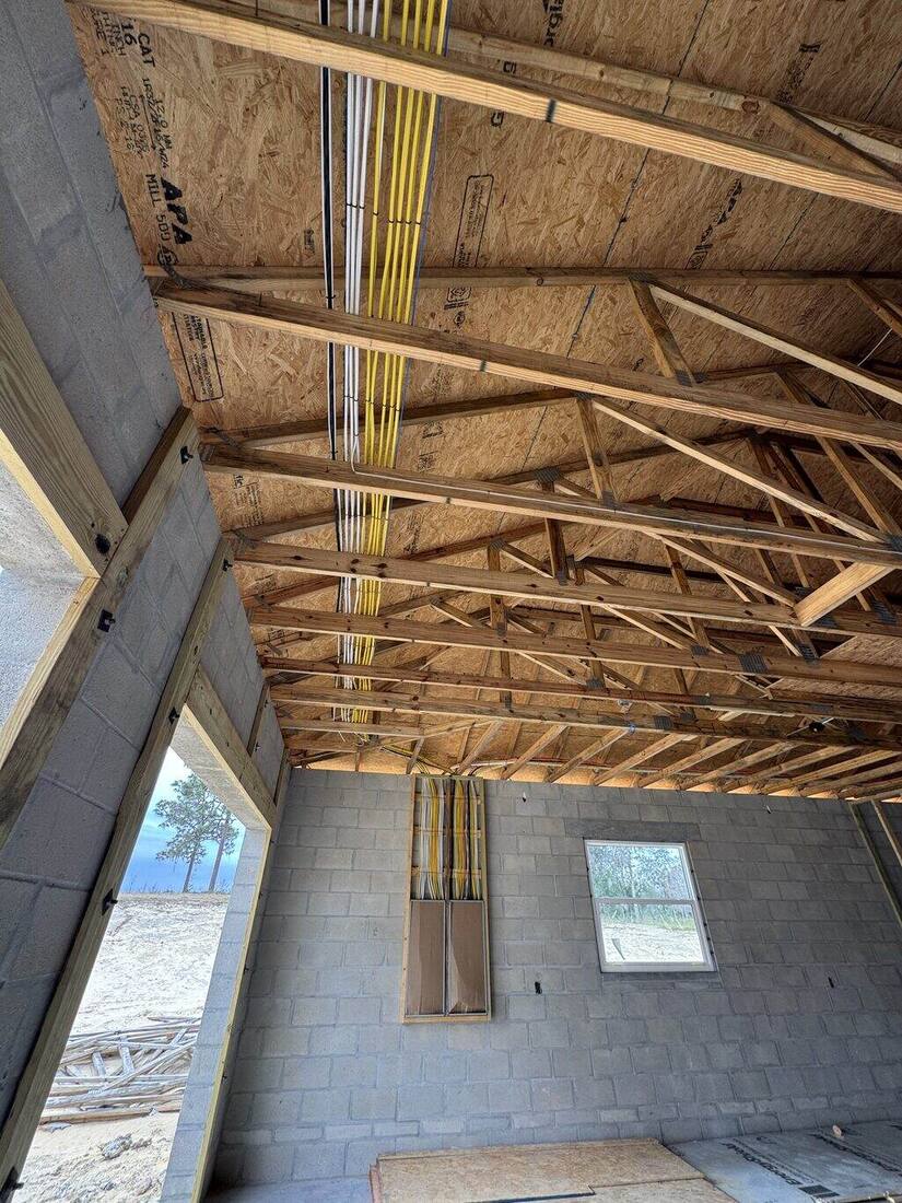 Wiring run through ceiling trusses on a new build