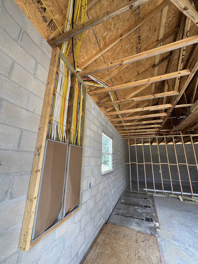 Rough-in wiring along a block wall with window opening